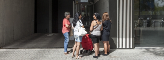 A group of women in front of a building facade