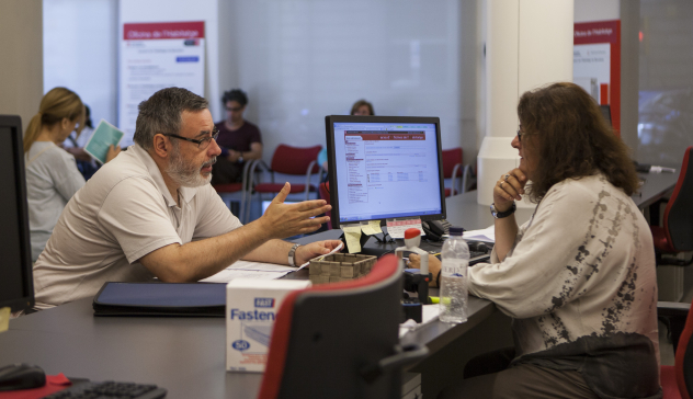 A man making an enquiry at a municipal office