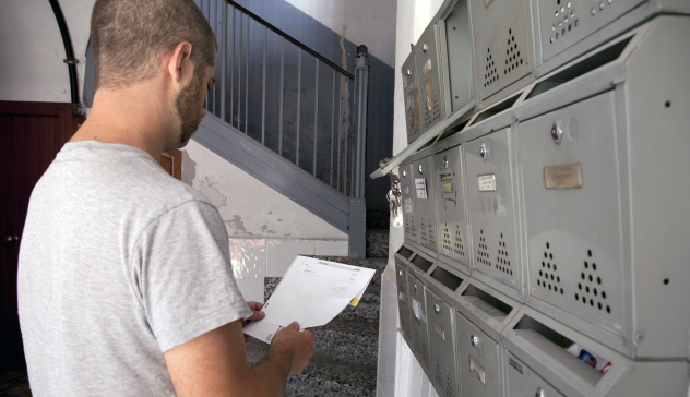 A man checks his mailbox