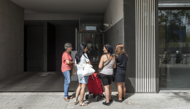 A group of women in front of a building facade